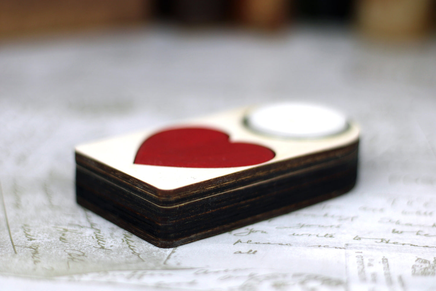 Engraved wooden candle holder with red heart motif and secret compartment, it holds tea light candle or nightlight