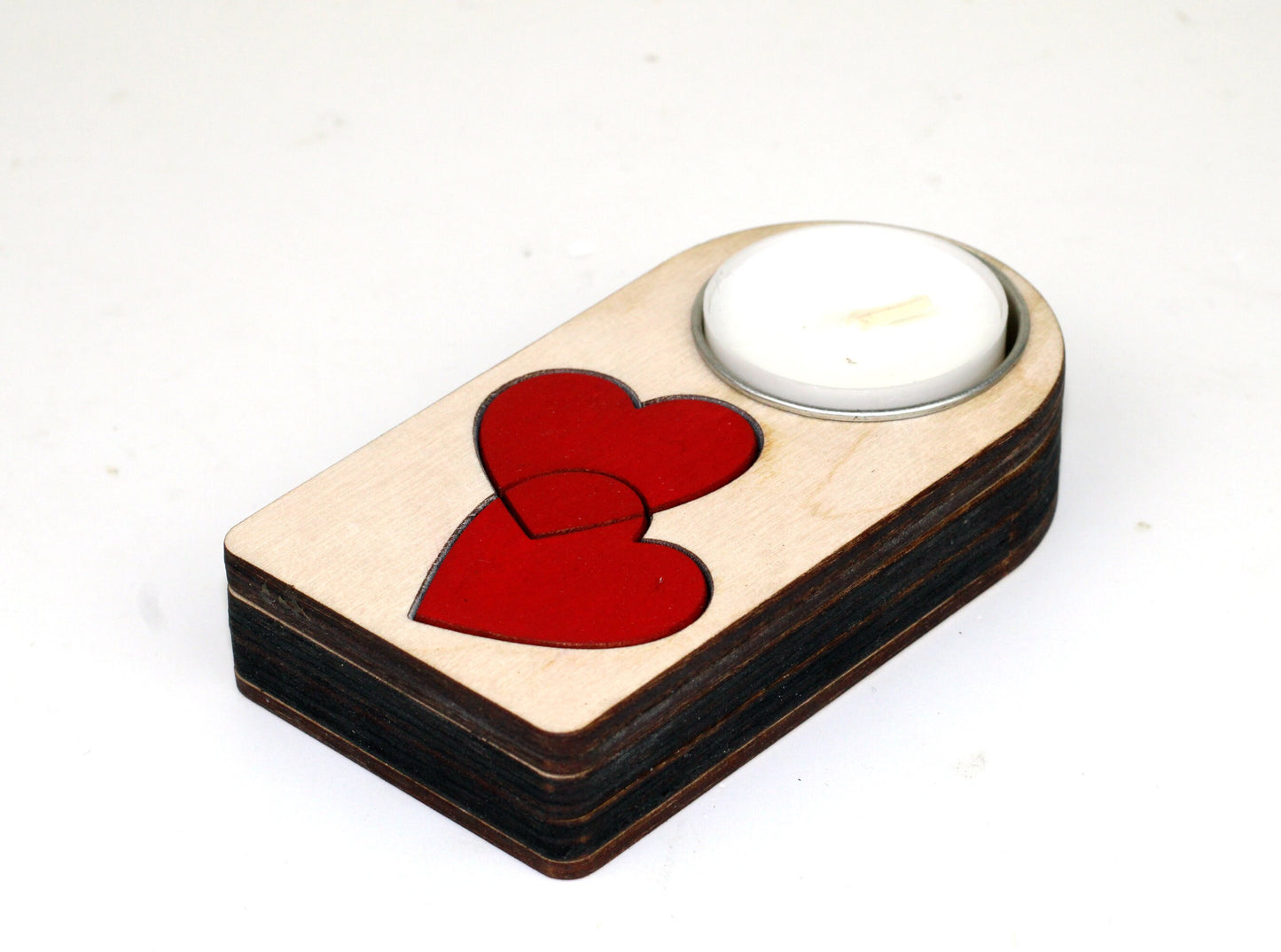 Engraved wooden candle holder with entwined hearts motif and secret compartment, it holds tea light candle or nightlight