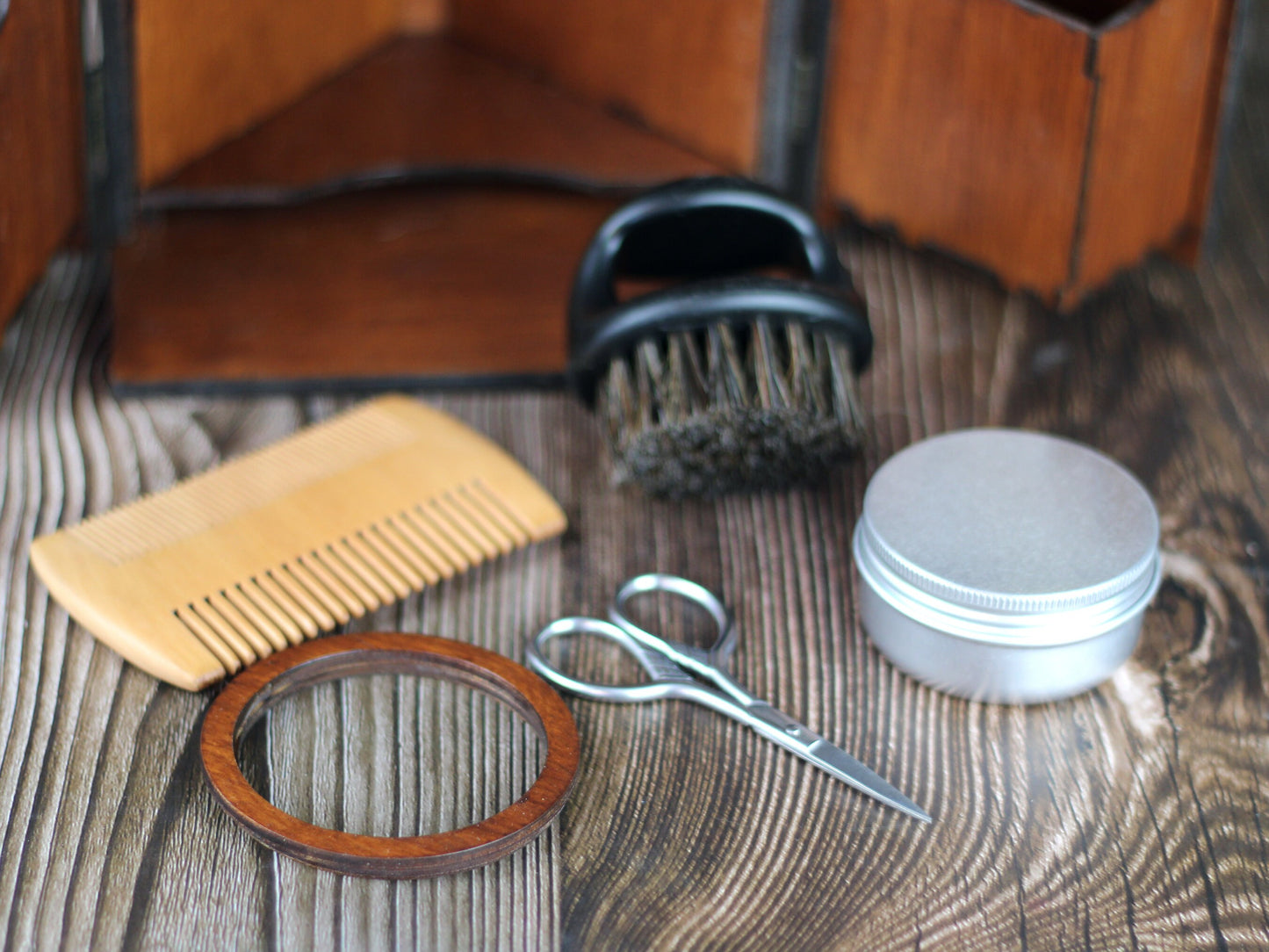 Beard care set in wooden cabinet with mirror, brush, comb and scissors. Edwardian style male grooming kit.