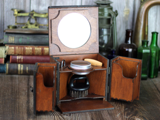 Beard care set in wooden cabinet with mirror, brush, comb and scissors. Edwardian style male grooming kit.